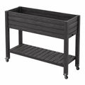 Jardinière surélevée 120 x 50 x 90 cm en bois noir avec étagère et roulettes